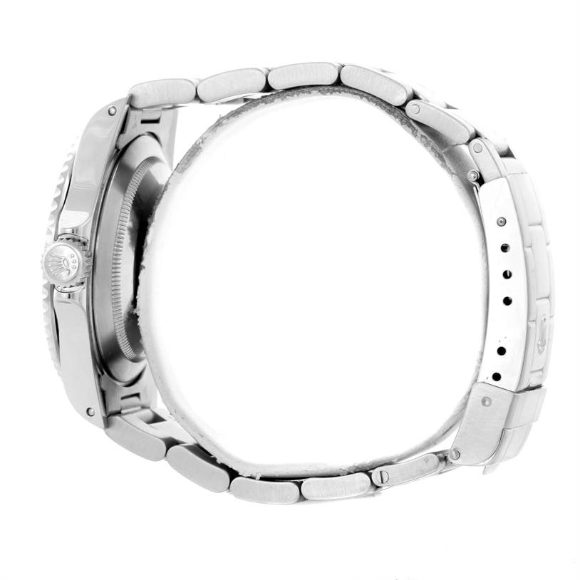 The image shows a side view of the Rolex Submariner 14060 Men
s Stainless Steel Black Dial 14060 Men
s Stainless Steel Black Dial
s case and stainless steel bracelet.