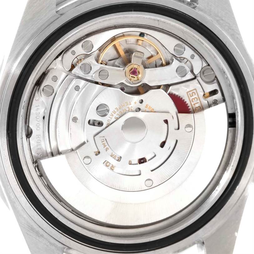 The image shows a detailed view of the movement and inner mechanisms of the Rolex Submariner 16610LV Men
s Stainless Steel Black Dial 16610LV Men
s Stainless Steel Black Dial watch, viewed from the back.