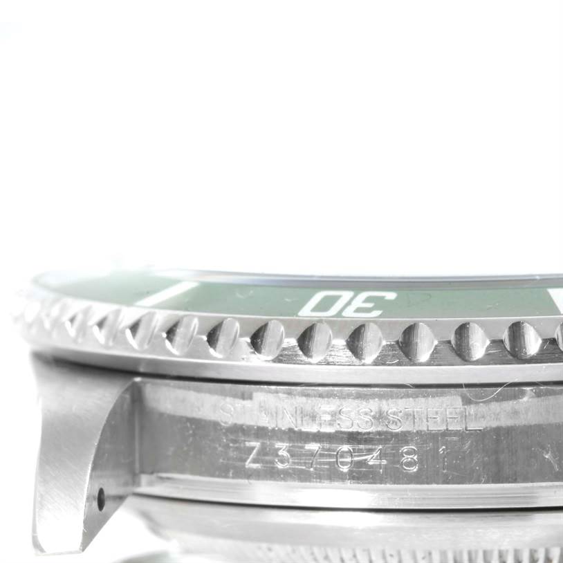 This image shows a close-up of the Rolex Submariner 16610LV Men
s Stainless Steel Black Dial 16610LV Men
s Stainless Steel Black Dial
s case and bezel from a side angle.