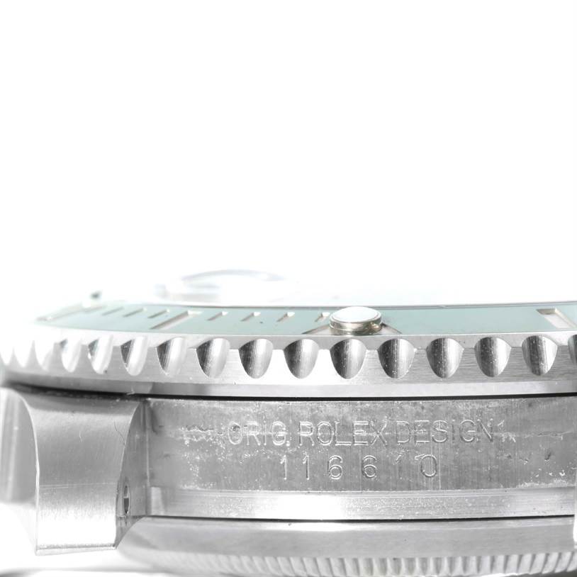 The image shows a close-up side view of the bezel and case side with engraving of a Rolex Submariner 116610LV Men's Stainless Steel Green Dial 116610LV Men's Stainless Steel Green Dial model.