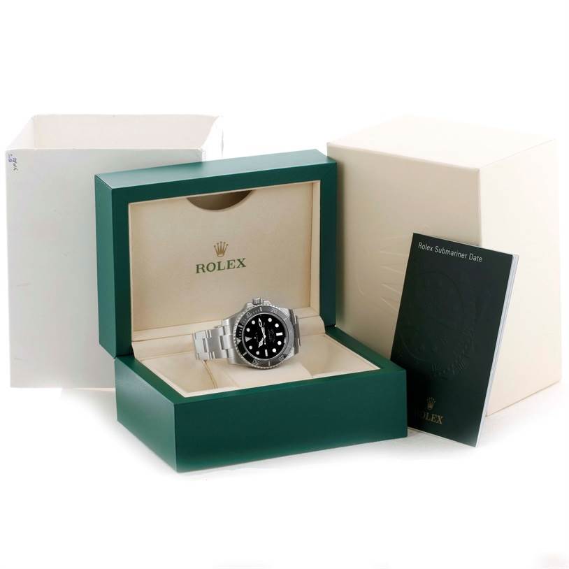 The image shows a Rolex Submariner 116610 Men
s Stainless Steel Black Dial 116610 Men
s Stainless Steel Black Dial watch in its open display box, along with the box cover and manual.