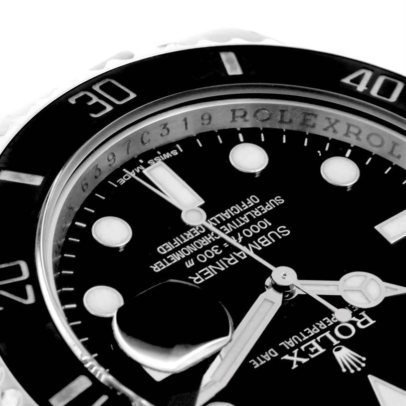 The image shows a close-up angle of a Rolex Submariner 116610 Men
s Stainless Steel Black Dial 116610 Men
s Stainless Steel Black Dial watch, focusing on the dial, bezel, and part of the serial number.