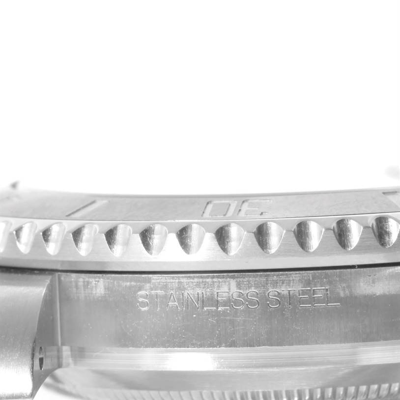 The image shows a close-up side view of the bezel and case of a Rolex Submariner 116610 Men
s Stainless Steel Black Dial 116610 Men
s Stainless Steel Black Dial, emphasizing the stainless steel material.