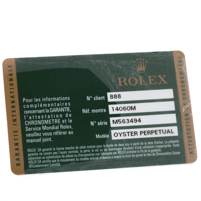 The image shows a close-up of a Rolex guarantee card for the Submariner model.