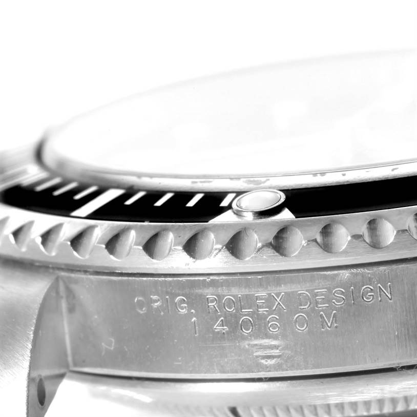 This close-up angle shows the bezel, crystal, and engraved case side of a Rolex Submariner 14060 Men
s Stainless Steel Black Dial 14060 Men
s Stainless Steel Black Dial model 14060M.