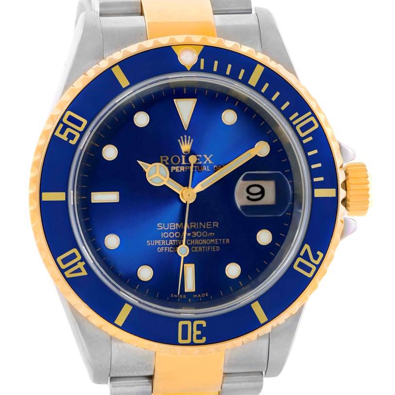 The image shows a Rolex Submariner 16613 Men
s Steel and Gold (two tone) Blue Dial 16613 Men
s Steel and Gold (two tone) Blue Dial watch from a frontal angle, highlighting the blue dial, date window, and two-tone bracelet.