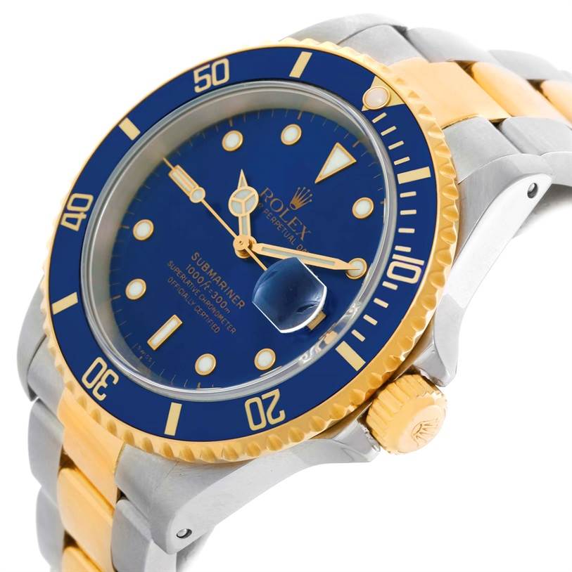 The image shows a Rolex Submariner 16613 Men
s Steel and Gold (two tone) Blue Dial 16613 Men
s Steel and Gold (two tone) Blue Dial watch, showcasing its dial, bezel, crown, and part of the bracelet at an angled side view.