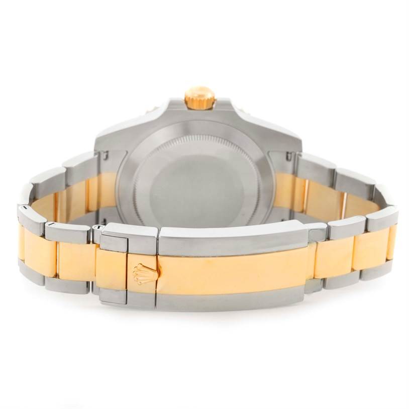 This image shows the back view of a Rolex Submariner 116613 Men
s Steel and Gold (two tone) Black Dial 116613 Men
s Steel and Gold (two tone) Black Dial watch, highlighting its case back and two-tone bracelet.