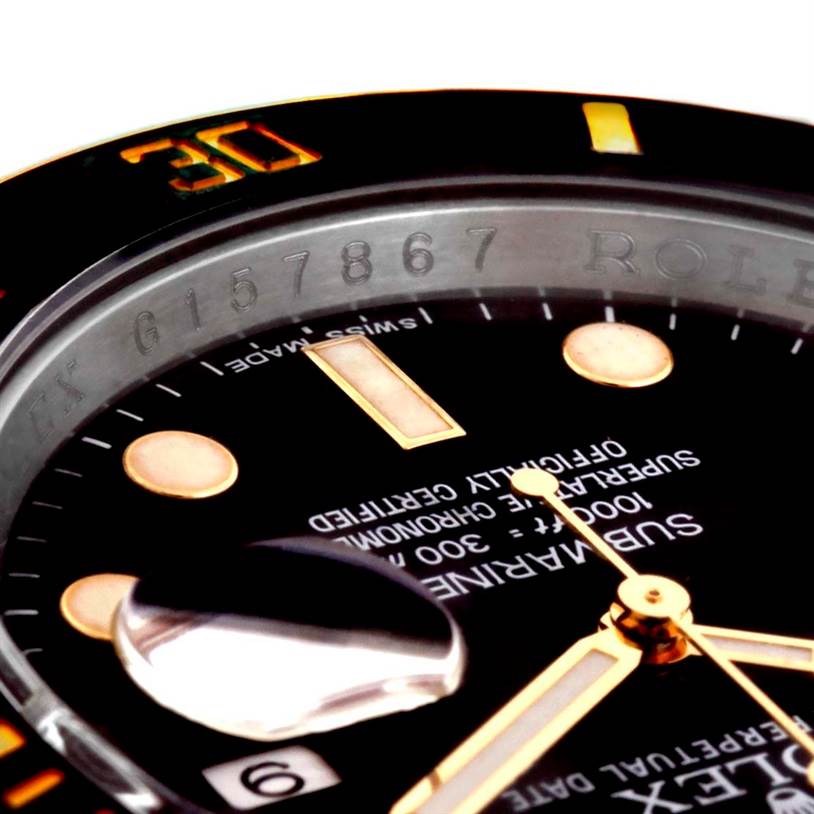 This close-up angle shows the dial, bezel, and date magnifier of the Rolex Submariner 116613 Men
s Steel and Gold (two tone) Black Dial 116613 Men
s Steel and Gold (two tone) Black Dial watch.