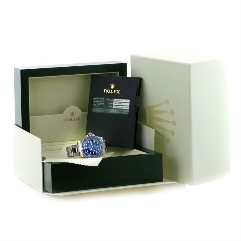 The image shows a Rolex Submariner 116619LB Men's White Gold Blue Dial 116619LB Men's White Gold Blue Dial watch with a blue dial, placed inside its open box alongside instruction booklets.