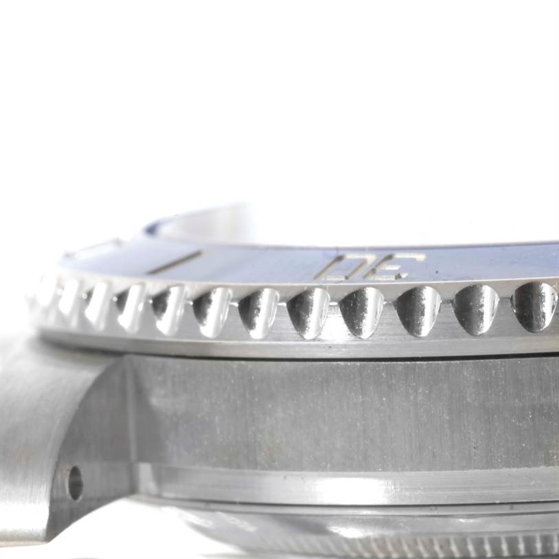 This is a close-up side view of the Rolex Submariner 116619LB Men's White Gold Blue Dial 116619LB Men's White Gold Blue Dial watch bezel and case.