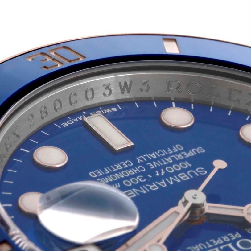 Close-up angle of the Rolex Submariner 116619LB Men's White Gold Blue Dial 116619LB Men's White Gold Blue Dial watch face, showing the bezel, hour markers, and the Cyclops lens over the date.