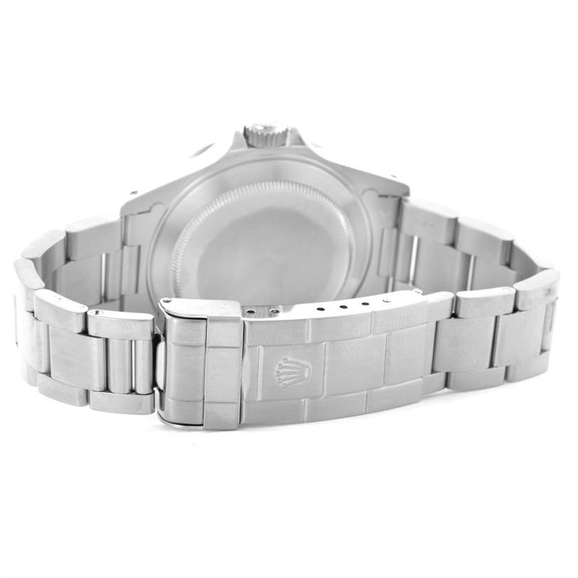 The image shows the back view of a Rolex Submariner 14060 Men
s Stainless Steel Black Dial 14060 Men
s Stainless Steel Black Dial watch, focusing on its caseback and bracelet with clasp.