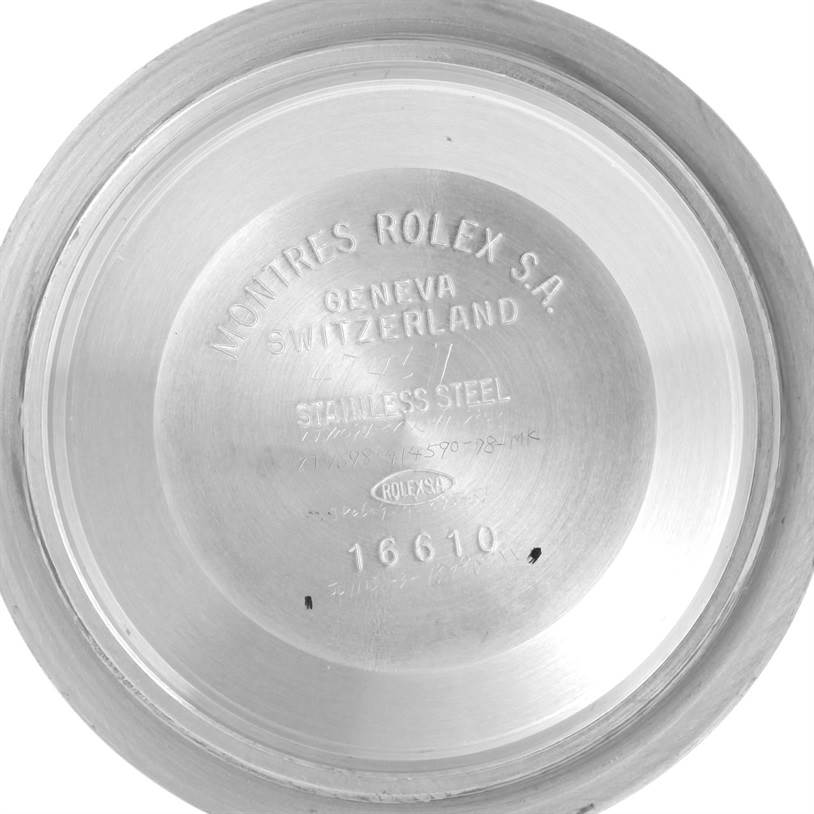 This image shows the inside case back of a Rolex Submariner 16613 Men's Steel and Gold (two tone) Champagne Dial 16613 Men's Steel and Gold (two tone) Champagne Dial model 16610, highlighting engravings and serial number.