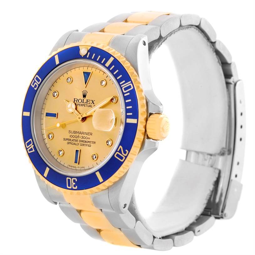 The Rolex Submariner 16613 Men's Steel and Gold (two tone) Champagne Dial 16613 Men's Steel and Gold (two tone) Champagne Dial watch is shown at a slight angle, displaying its face, bezel, crown, and part of the bracelet.