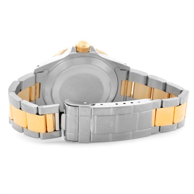 The image shows the case back and bracelet clasp of a Rolex Submariner 16613 Men's Steel and Gold (two tone) Champagne Dial 16613 Men's Steel and Gold (two tone) Champagne Dial watch, including the crown.