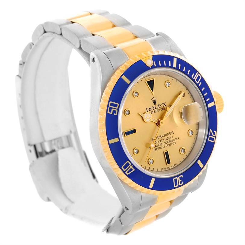 This Rolex Submariner 16613 Men's Steel and Gold (two tone) Champagne Dial 16613 Men's Steel and Gold (two tone) Champagne Dial watch is shown at a three-quarter angle, displaying the face, bracelet, bezel, and crown.