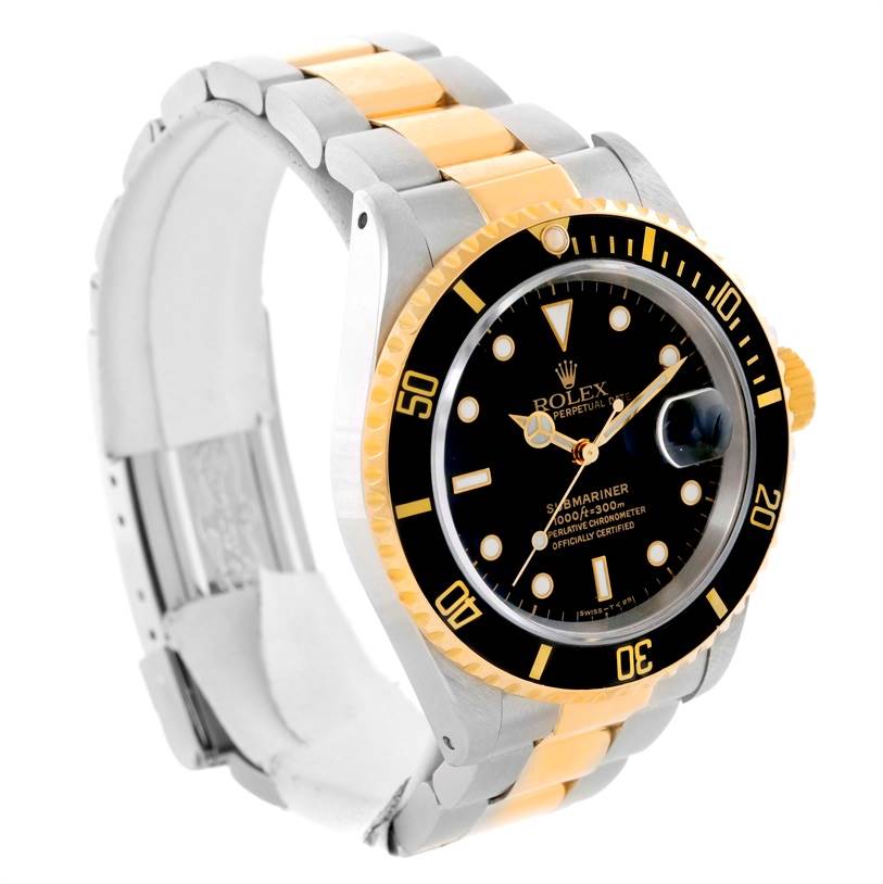 The image shows a Rolex Submariner 16613 Men
s Steel and Gold (two tone) Black Dial 16613 Men
s Steel and Gold (two tone) Black Dial watch at an angle highlighting its black dial, bezel, and two-tone metal bracelet.