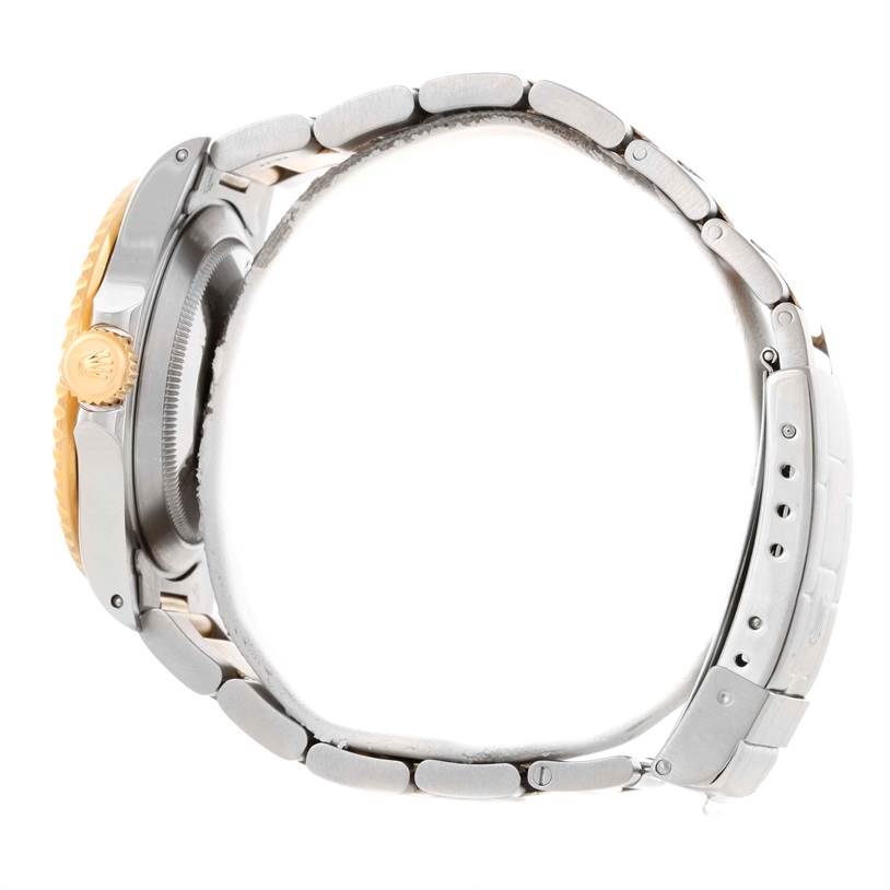 The image shows a side view of the Rolex Submariner 16613 Men
s Steel and Gold (two tone) Black Dial 16613 Men
s Steel and Gold (two tone) Black Dial watch, highlighting the case, crown, and bracelet links.