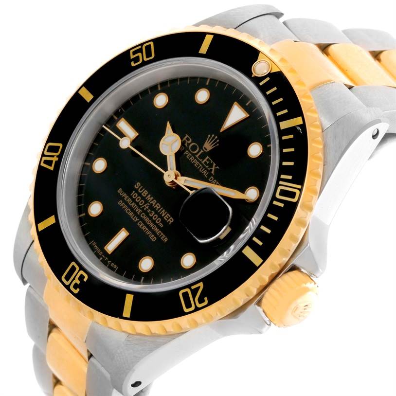 The image shows a Rolex Submariner 16613 Men
s Steel and Gold (two tone) Black Dial 16613 Men
s Steel and Gold (two tone) Black Dial watch at an angled view, highlighting the dial, crown, and part of the bracelet.