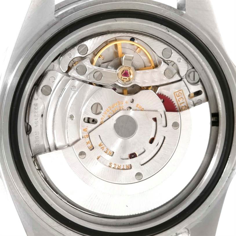 This image shows the inner movement mechanism of a Rolex Submariner 16610 Men
s Stainless Steel Black Dial 16610 Men
s Stainless Steel Black Dial watch from a rear angle.
