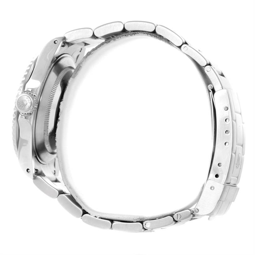 The image shows a side profile of a Rolex Submariner 16610 Men
s Stainless Steel Black Dial 16610 Men
s Stainless Steel Black Dial, highlighting its crown, bezel, and metal bracelet.