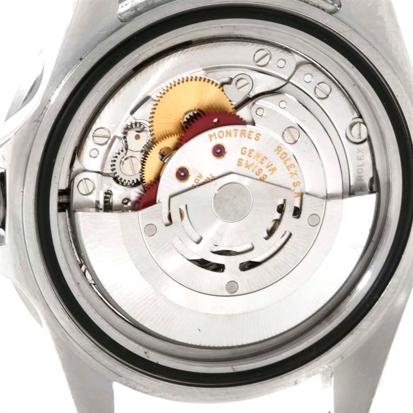 This image shows the back of a Rolex Submariner 16610 Men
s Stainless Steel Black Dial 16610 Men
s Stainless Steel Black Dial watch, revealing its intricate mechanical movement and components.