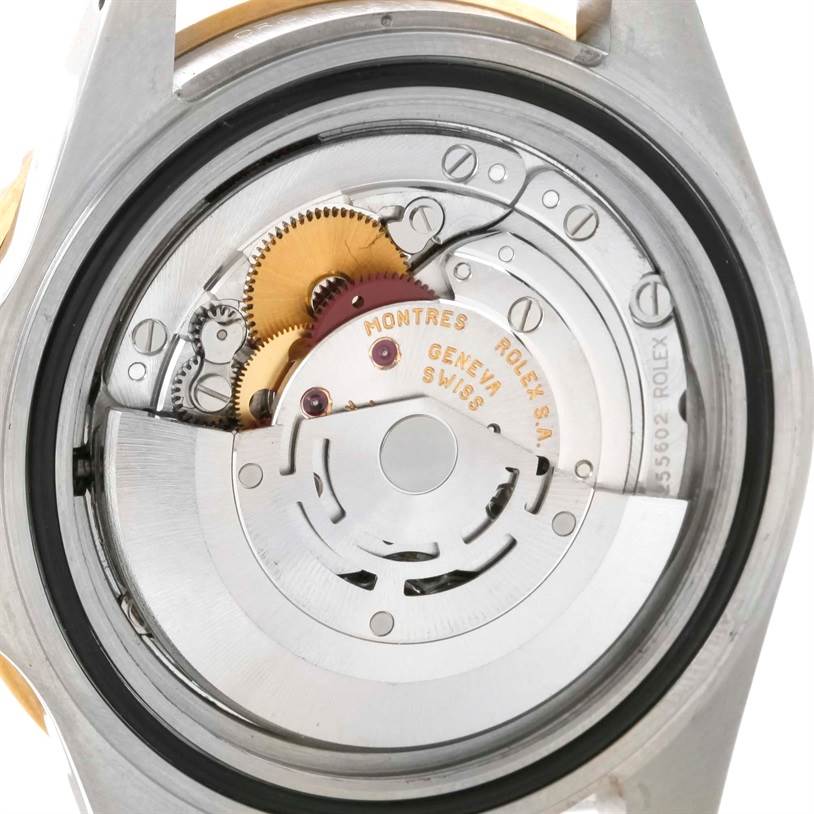 This image shows the internal mechanism of a Rolex Submariner 16613 Men's Steel and Gold (two tone) Black Dial 16613 Men's Steel and Gold (two tone) Black Dial watch, viewed from a rear angle.