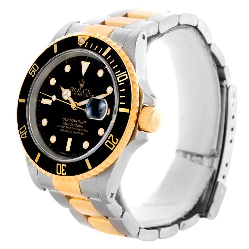 The Rolex Submariner 16613 Men's Steel and Gold (two tone) Black Dial 16613 Men's Steel and Gold (two tone) Black Dial is shown at an angle revealing the face, bezel, crown, and part of the two-tone bracelet.