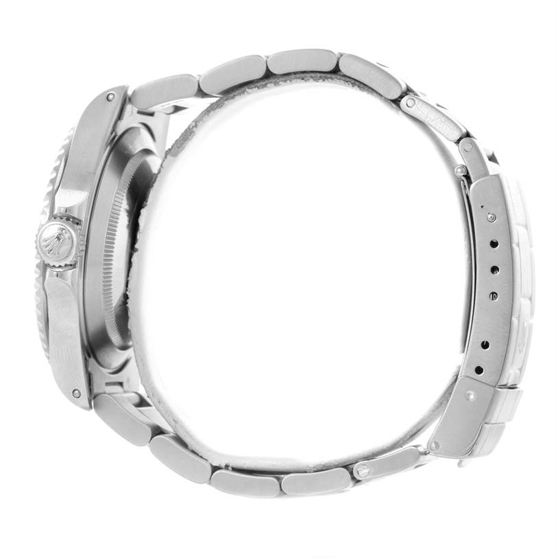 The image shows a Rolex Submariner 14060 Men
s Stainless Steel Black Dial 14060 Men
s Stainless Steel Black Dial watch from a side angle, highlighting the crown and bracelet links.