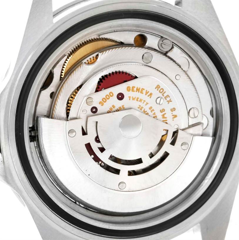 This image shows the internal mechanism of a Rolex Submariner 14060 Men
s Stainless Steel Black Dial 14060 Men
s Stainless Steel Black Dial watch from a back view, highlighting its gears and movement components.