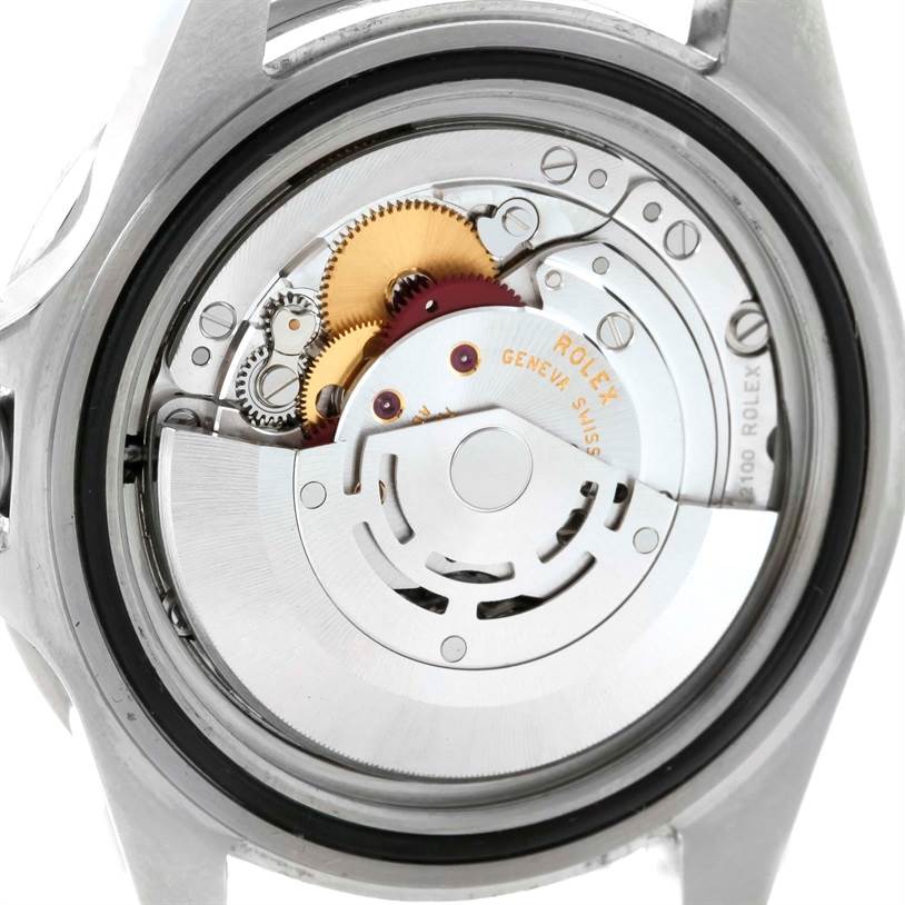 The image shows the case back view of a Rolex Submariner 16610LV Men
s Stainless Steel Black Dial 16610LV Men
s Stainless Steel Black Dial, revealing its intricate movement and inner mechanics.