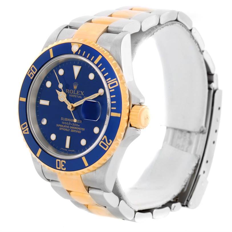 The Rolex Submariner 16613 Men's Steel and Gold (two tone) Blue Dial 16613 Men's Steel and Gold (two tone) Blue Dial watch is shown at a slight angle, highlighting its blue dial, bezel, and bi-metal bracelet.