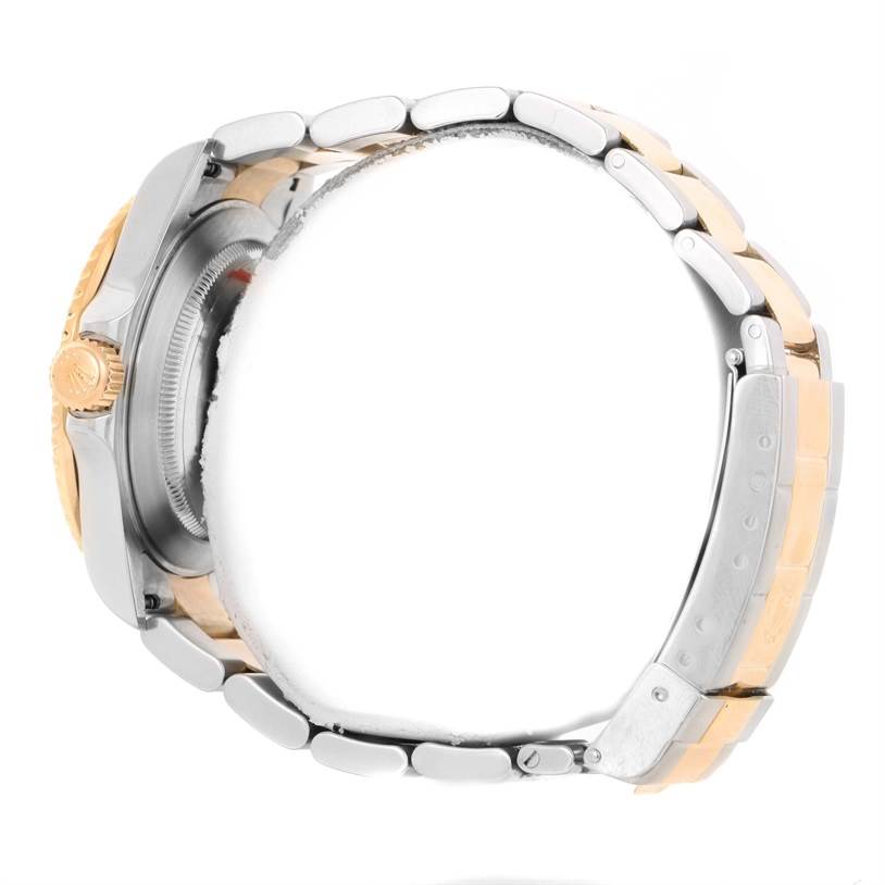 The image shows a side view of a Rolex Submariner 16613 Men's Steel and Gold (two tone) Blue Dial 16613 Men's Steel and Gold (two tone) Blue Dial watch, focusing on the band, crown, and case.