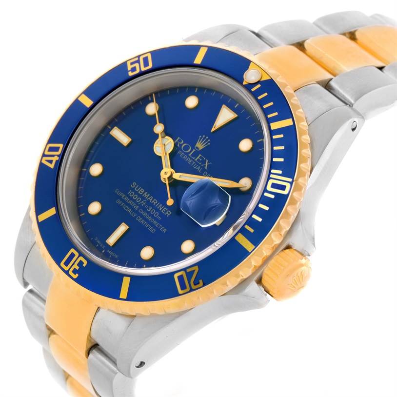 This Rolex Submariner 16613 Men's Steel and Gold (two tone) Blue Dial 16613 Men's Steel and Gold (two tone) Blue Dial watch is shown at a slight angle, highlighting its blue dial, bezel, and gold and silver bracelet.