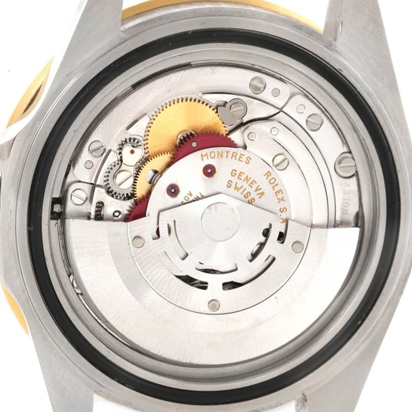 This image shows a close-up view of the internal movement components of a Rolex Submariner 16613 Men's Steel and Gold (two tone) Blue Dial 16613 Men's Steel and Gold (two tone) Blue Dial watch.