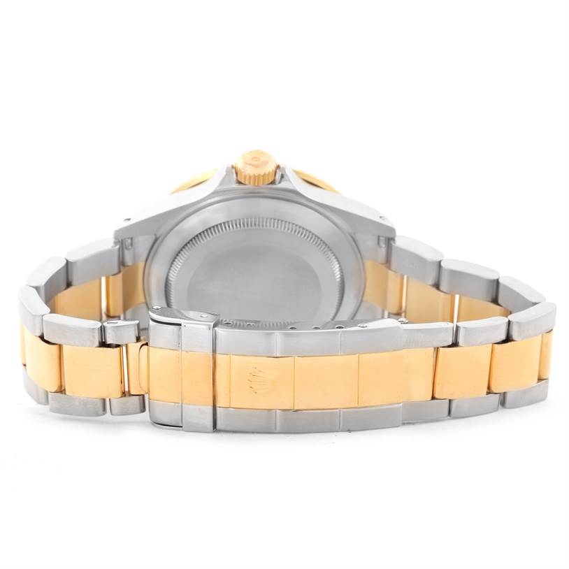 This image shows the back of a Rolex Submariner 16613 Men's Steel and Gold (two tone) Blue Dial 16613 Men's Steel and Gold (two tone) Blue Dial watch, focusing on the stainless steel and gold bracelet with the clasp open.