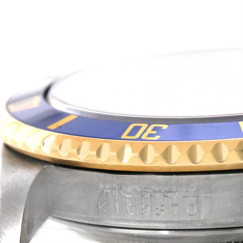 This image shows a close-up side view of the case and bezel of a Rolex Submariner 16613 Men's Steel and Gold (two tone) Blue Dial 16613 Men's Steel and Gold (two tone) Blue Dial watch.