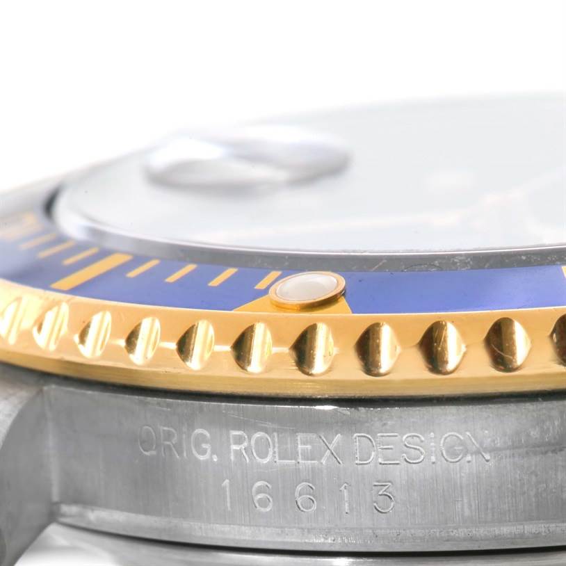 The image shows a close-up side view of the bezel and case of a Rolex Submariner 16613 Men's Steel and Gold (two tone) Blue Dial 16613 Men's Steel and Gold (two tone) Blue Dial watch, model 16613.