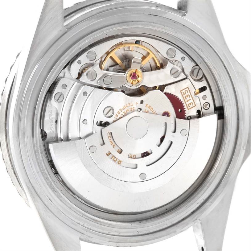 This image shows the internal mechanical movement of a Rolex Submariner 16610 Men
s Stainless Steel Black Dial 16610 Men
s Stainless Steel Black Dial watch from a rear angle.