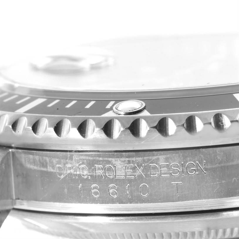 This image shows a close-up of the bezel, dial edge, and engraved case of a Rolex Submariner 16610 Men
s Stainless Steel Black Dial 16610 Men
s Stainless Steel Black Dial model 16610.