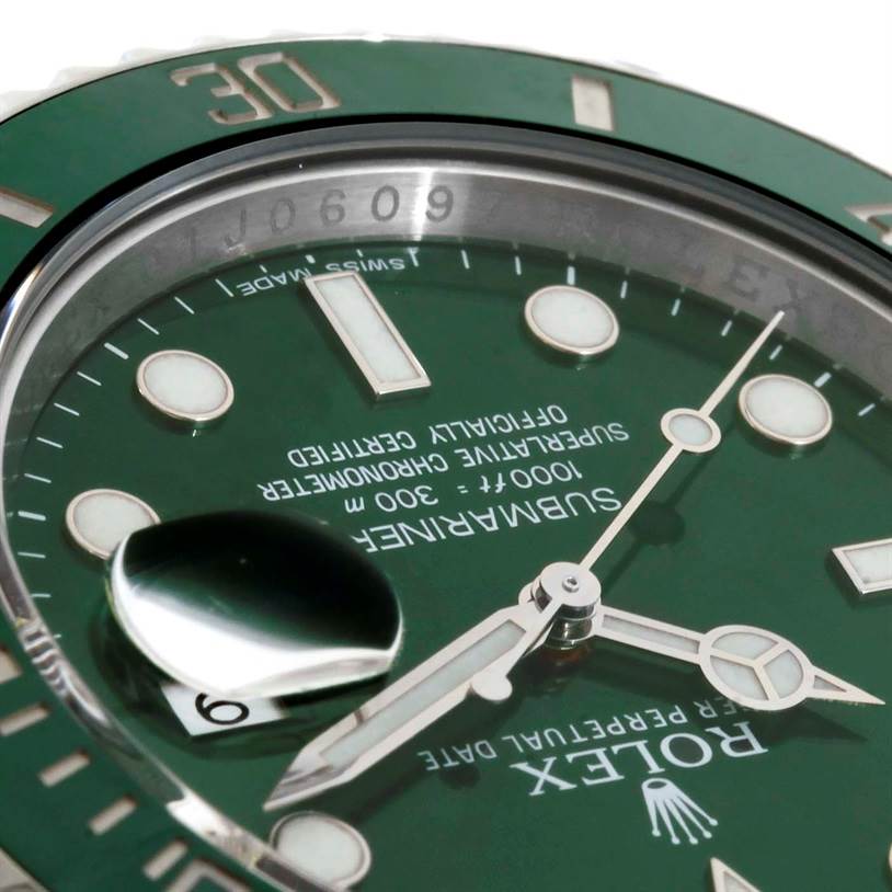 This image shows a close-up of the dial and bezel of a Rolex Submariner 116610LV Men
s Stainless Steel Green Dial 116610LV Men
s Stainless Steel Green Dial watch, highlighting the green face, hands, and date magnifier.