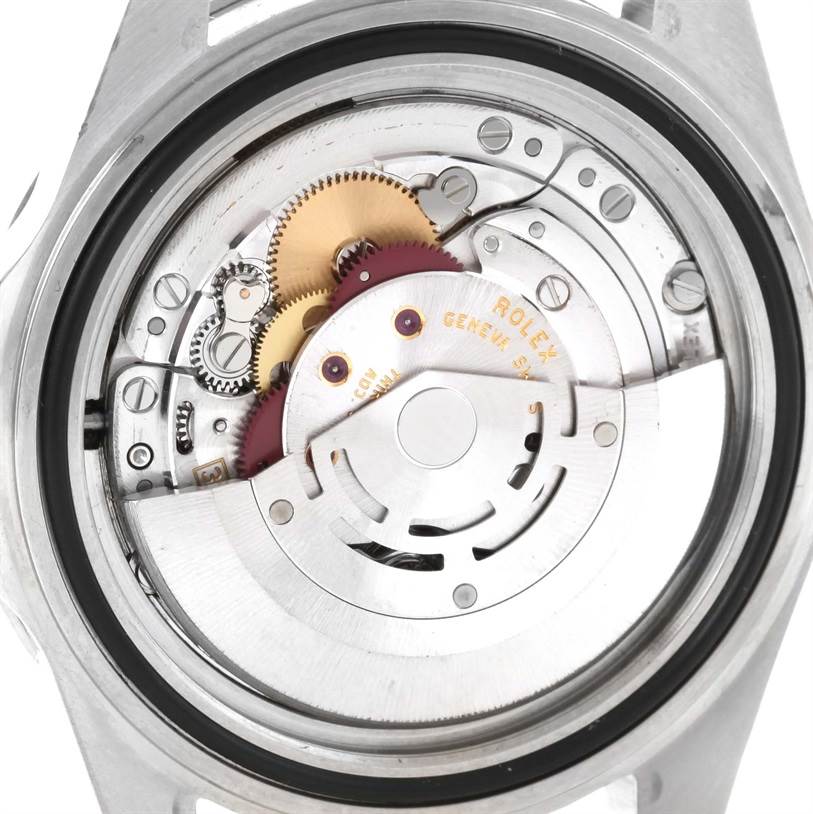 This image shows the internal mechanism of a Rolex Submariner 14060 Men
s Stainless Steel Black Dial 14060 Men
s Stainless Steel Black Dial watch, viewed from the back, revealing its intricate gears and components.