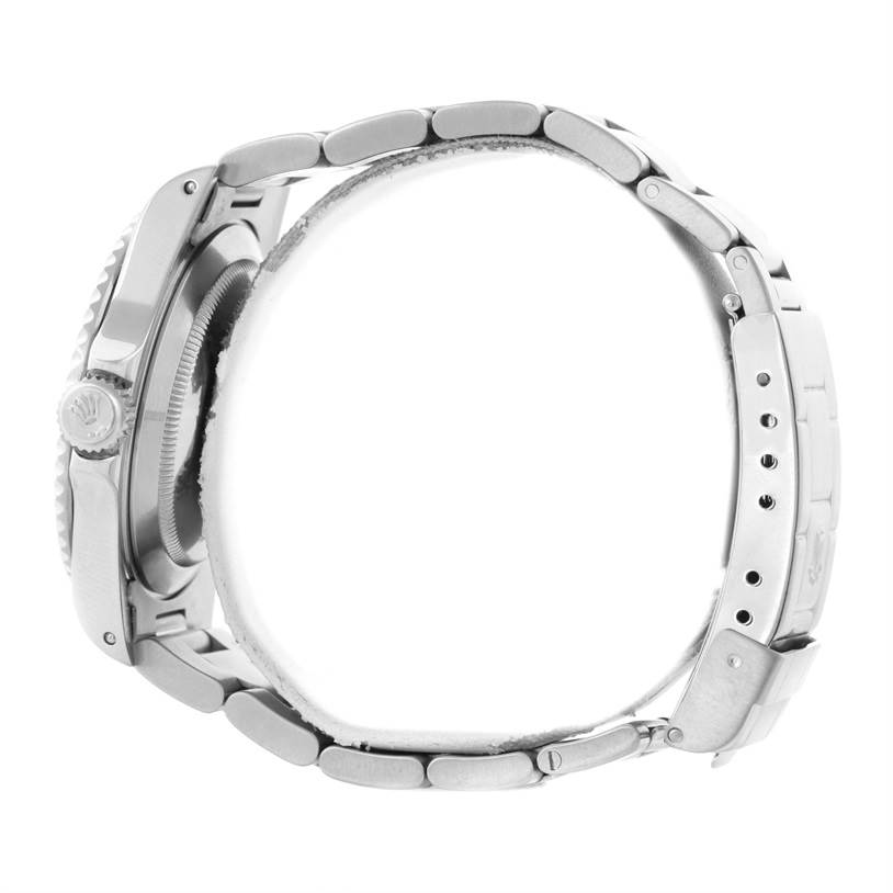 The image shows a side view of a Rolex Submariner 14060 Men
s Stainless Steel Black Dial 14060 Men
s Stainless Steel Black Dial watch, highlighting the case, crown, bezel, and metal bracelet.