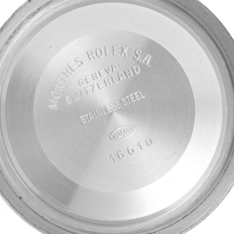 This is the interior of the case back of a Rolex Submariner 16613 Men's Steel and Gold (two tone) Black Dial 16613 Men's Steel and Gold (two tone) Black Dial, displaying model and manufacturing details.