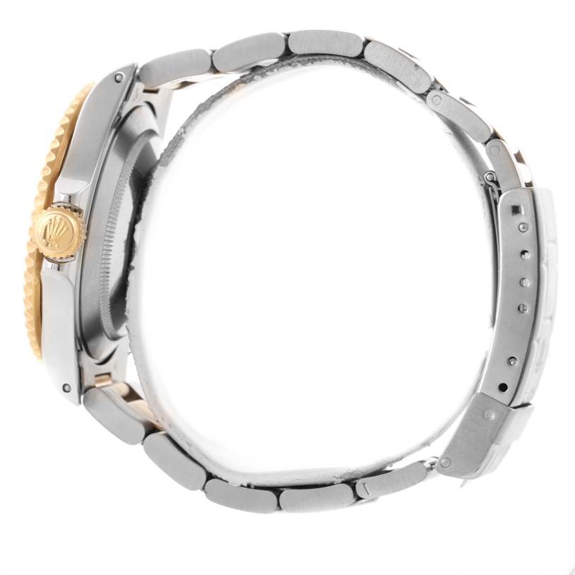 The image shows a side view of the Rolex Submariner 16613 Men's Steel and Gold (two tone) Black Dial 16613 Men's Steel and Gold (two tone) Black Dial watch, highlighting the crown, bezel, and bracelet.