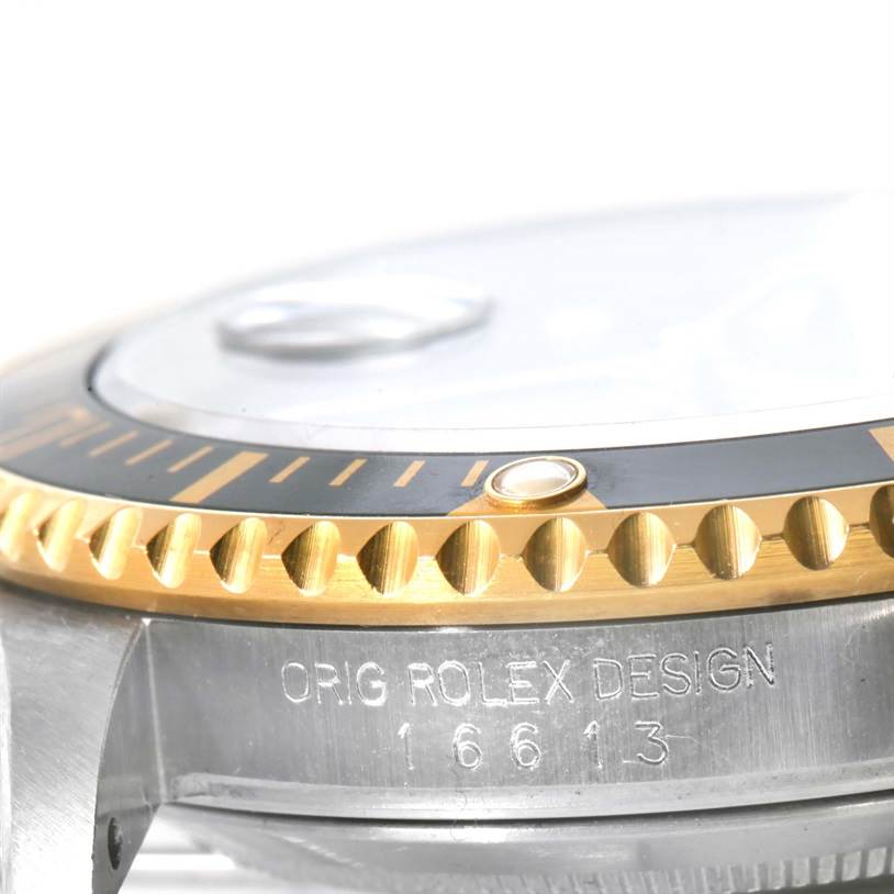 The image shows a close-up side view of the bezel and case with the model number of the Rolex Submariner 16613 Men's Steel and Gold (two tone) Black Dial 16613 Men's Steel and Gold (two tone) Black Dial.