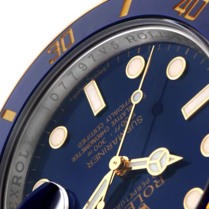 This close-up angle showcases the blue dial, bezel, and part of the inscription of the Rolex Submariner 116613 Men's Steel and Gold (two tone) Blue Dial 116613 Men's Steel and Gold (two tone) Blue Dial model.