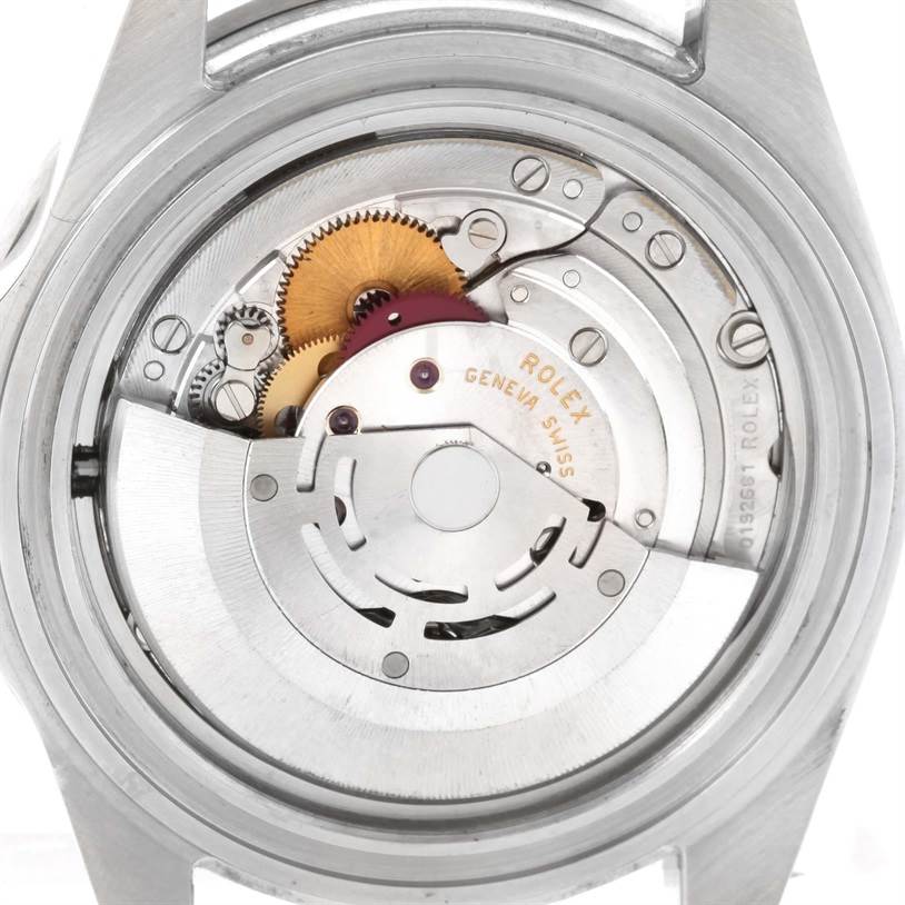 The image shows the Rolex Submariner 16610LV Men
s Stainless Steel Black Dial 16610LV Men
s Stainless Steel Black Dial watch
s internal movement from the back, revealing its mechanical components.