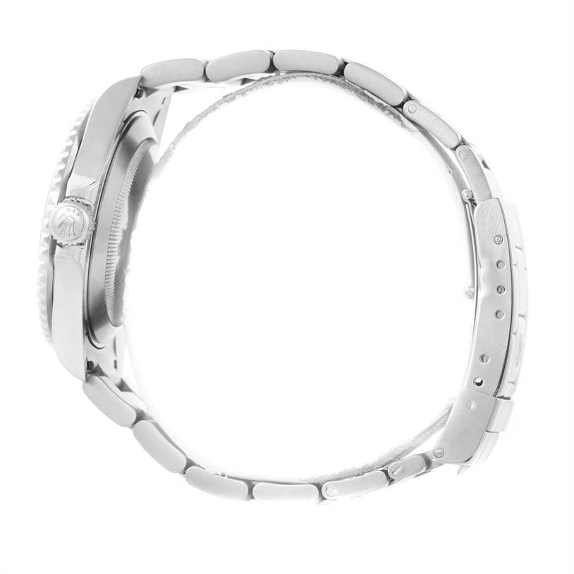 The image shows a Rolex Submariner 16610 Men
s Stainless Steel Black Dial 16610 Men
s Stainless Steel Black Dial watch from a side view, highlighting the case, crown, and bracelet.